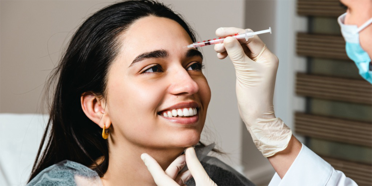 A woman getting botox on the frown lines