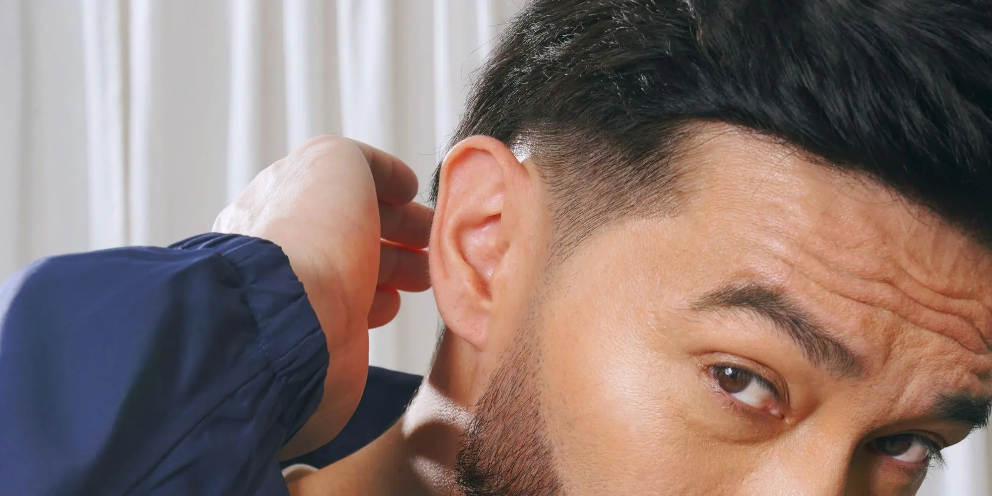 Jared Dillinger reflecting on identity, confidence, and hair restoration, representing the “Own Your Roots” philosophy through a premium lifestyle and personal growth narrative.
