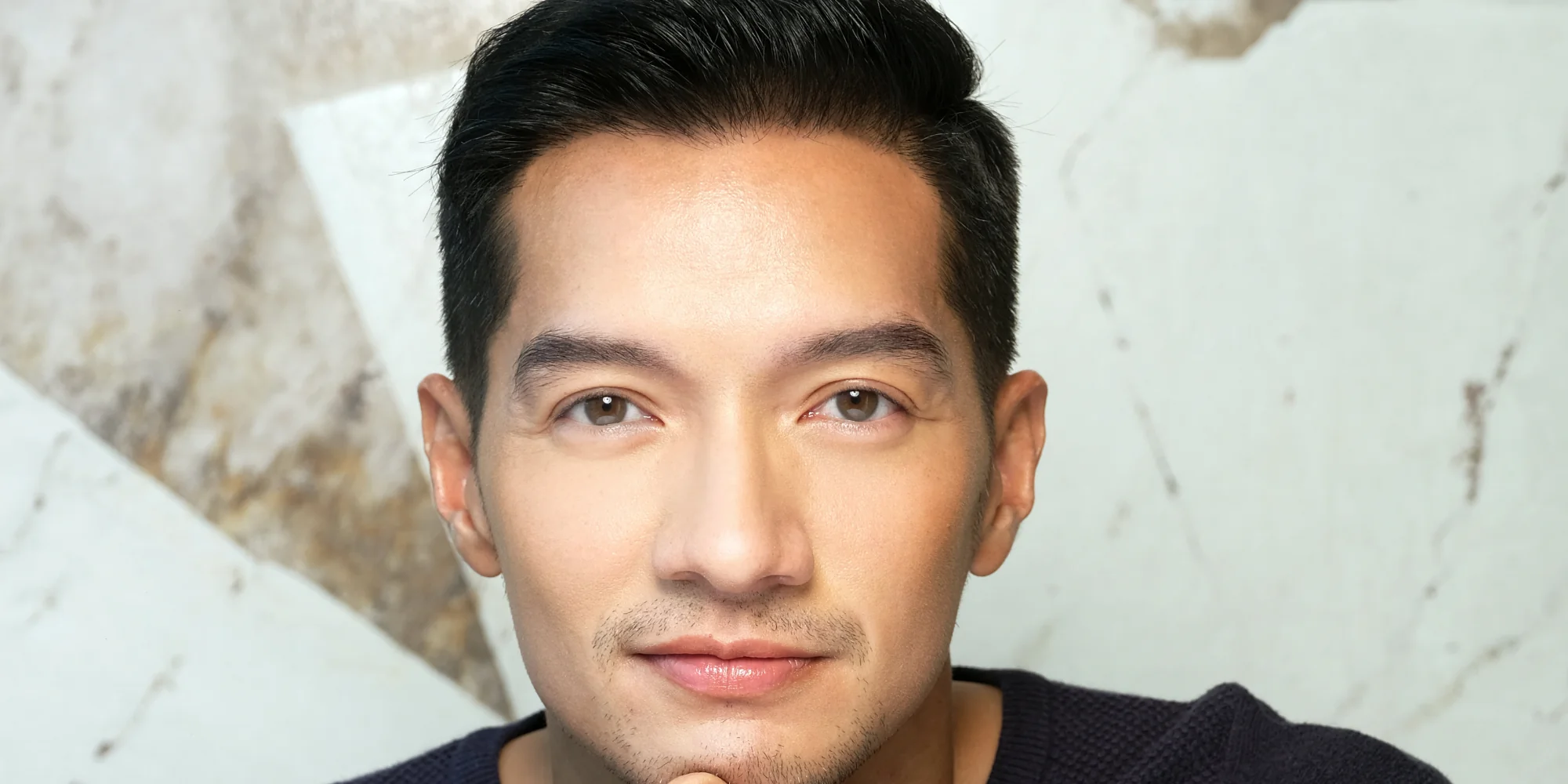 Portrait of Doc AJ after undergoing Rejuran treatment, showing improved skin quality associated with treatment for acne scars (atrophic, boxcar, rolling), uneven skin texture, post-inflammatory healing, hyperpigmentation (PIH), and skin barrier repair in sensitised skin.